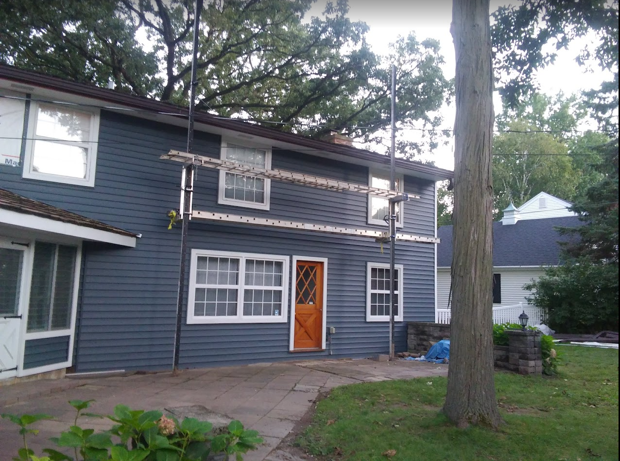 blue siding with scaffolding