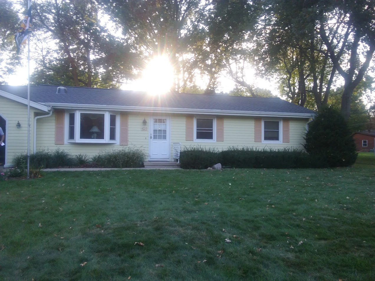 house with sun above